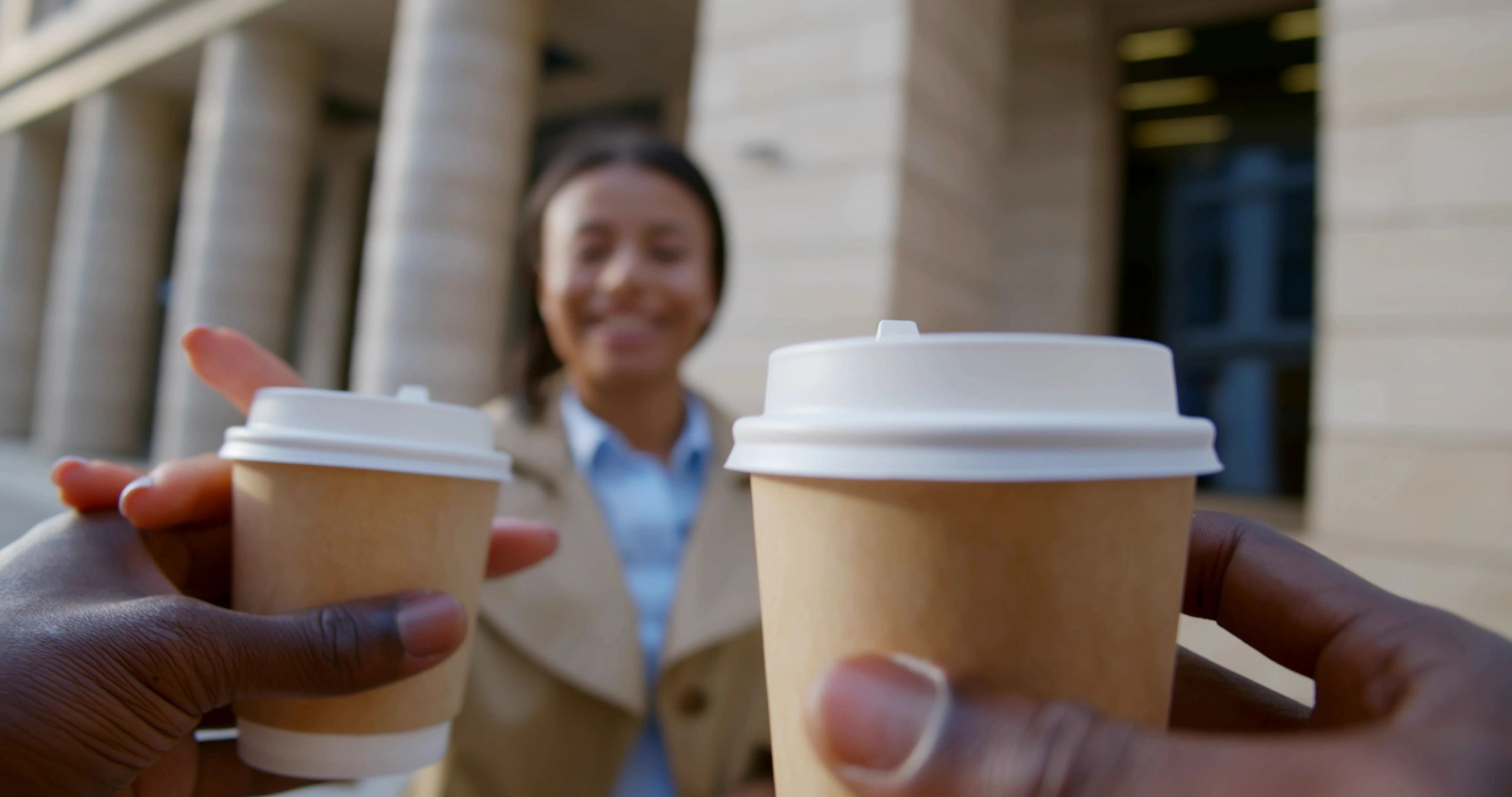 Pov shot of man bringing takeaway coffee to the event.